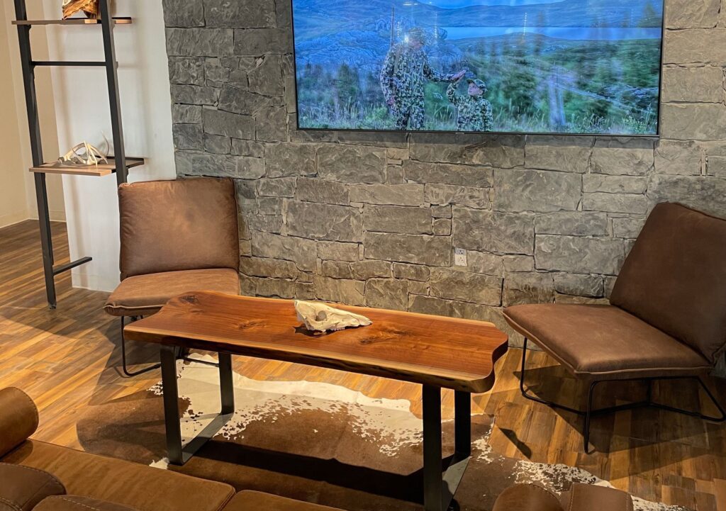 South Loft live-edge wood coffee table in a rustic lounge area.